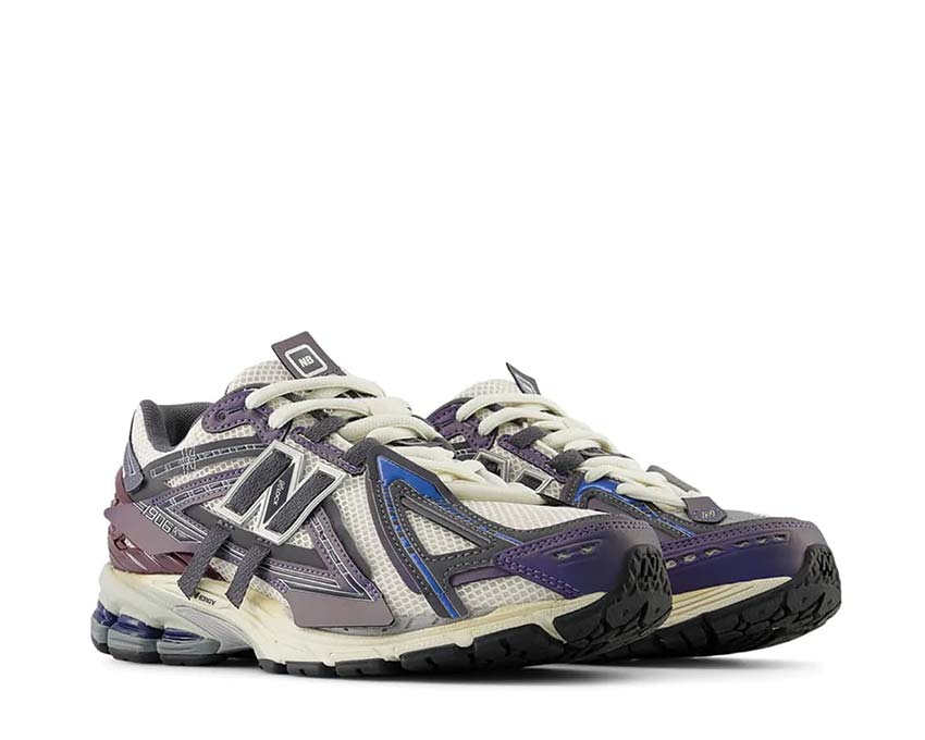 New Balance 1906A Inkwell vista lateral — parte superior mesh metálico superposiciones