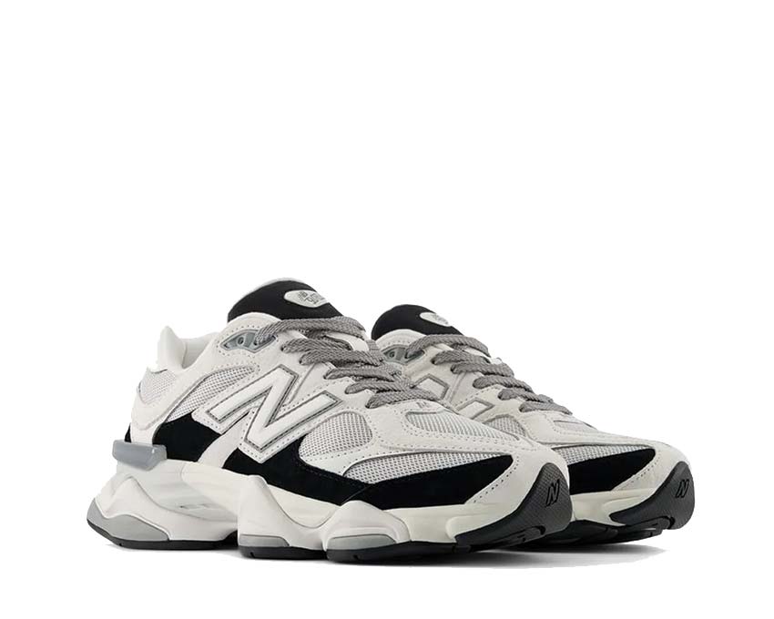 New Balance 9060 Jet Black vista lateral — superposiciones de mesh y ante