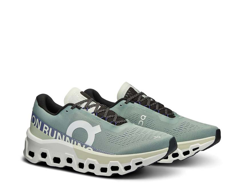 On Cloudmonster 2 Mineral/Aloe vista lateral — perfil amortiguación zapatilla running hombre