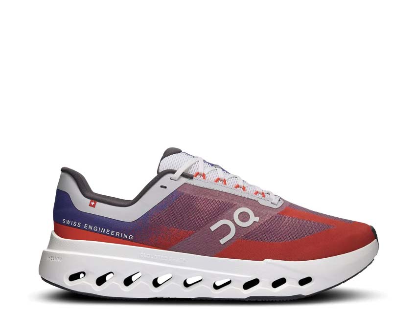 On Cloudsurfer Next Indigo/Flame — zapatilla running hombre CloudTec reactivo flexible
