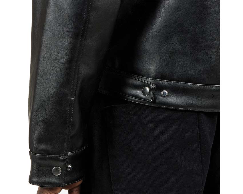Arte Jasper Double Jacket Black detail — logo closure