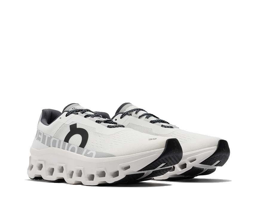 On Cloudmonster Undyed White side view — CloudTec cushioning